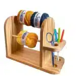 Wooden yarn holder stand for crochet with scissors and colorful hooks — perfect for organizing yarn and tools for amigurumi projects