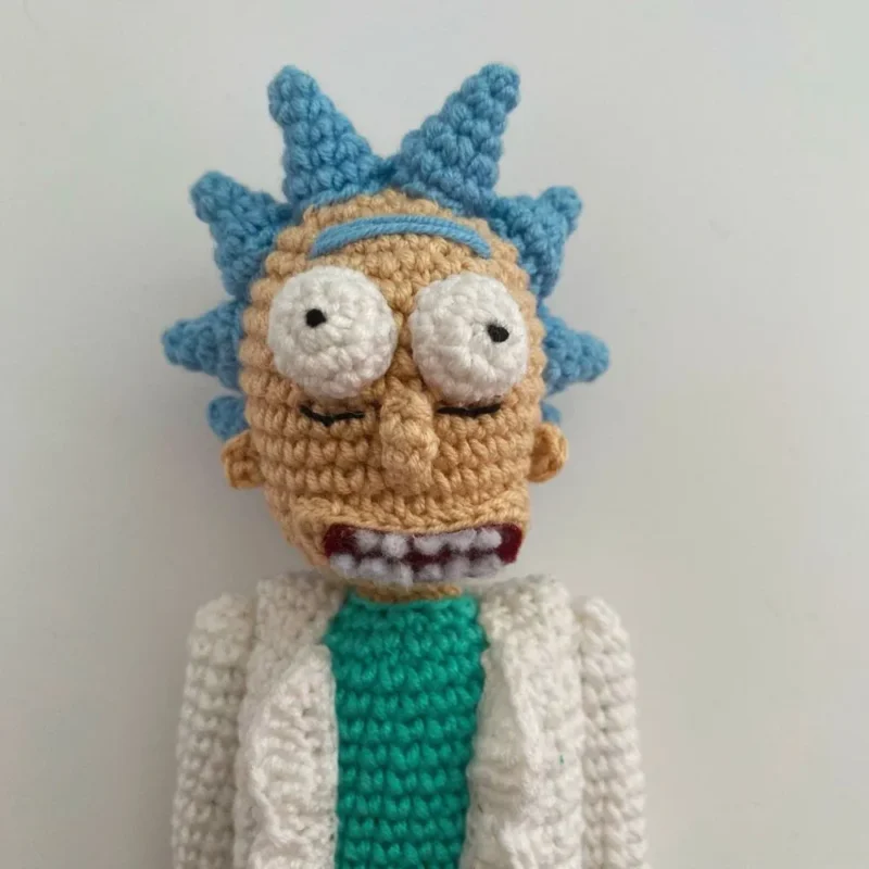 Full-body view of Rick Sanchez from Rick and Morty, potentially holding a gadget, depicted in a dynamic pose - amigurumi character design by Sage & Silky.