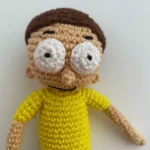 Morty Smith from Rick and Morty with his classic yellow shirt and worried expression - Sage & Silky crochet pattern character.