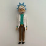 Close-up of Rick Sanchez from Rick and Morty, showcasing his signature lab coat and spiky blue hair - Sage & Silky crochet character inspiration.