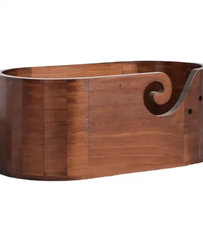 Wooden yarn bowl holder for crochet and amigurumi projects featuring a handcrafted swirl cutout design