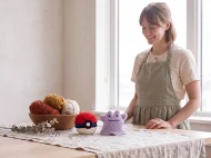 ditto reversible crochet pattern — the finished Ditto plush and its crocheted ball on a linen covered table in the studio