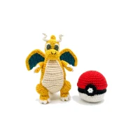 Dragonite reversible crochet pattern — the Dragonite plush beside its closed poke ball form