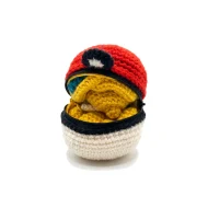 Dragonite reversible crochet pattern — the ball unzipped with Dragonite folded inside