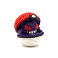 Gengar reversible crochet pattern — the ball unzipped with Gengar folded inside