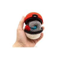 Magnemite reversible crochet pattern — the finished plush held in a hand to show its real size