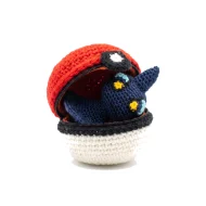 Shuppet reversible crochet pattern — the ball unzipped with Shuppet folded inside