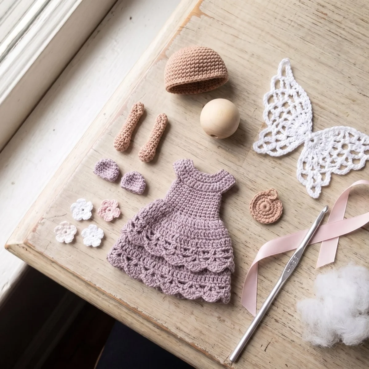 All the pieces from the crochet angel ornament pattern laid out before assembly