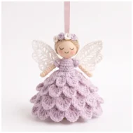 Crochet angel ornament pattern — the finished lace-wing angel on a pink ribbon