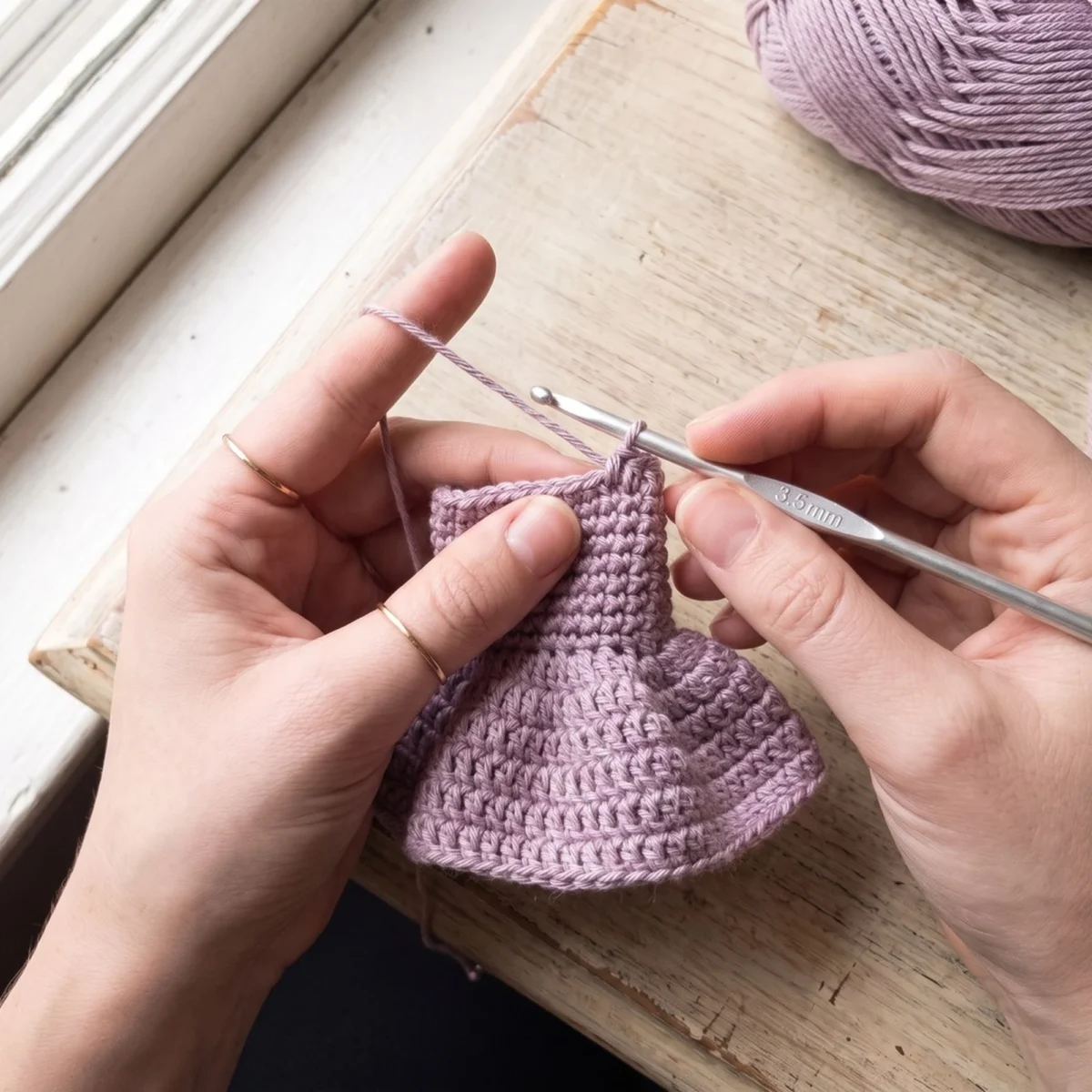 Working the crochet angel ornament pattern skirt into the back loops only