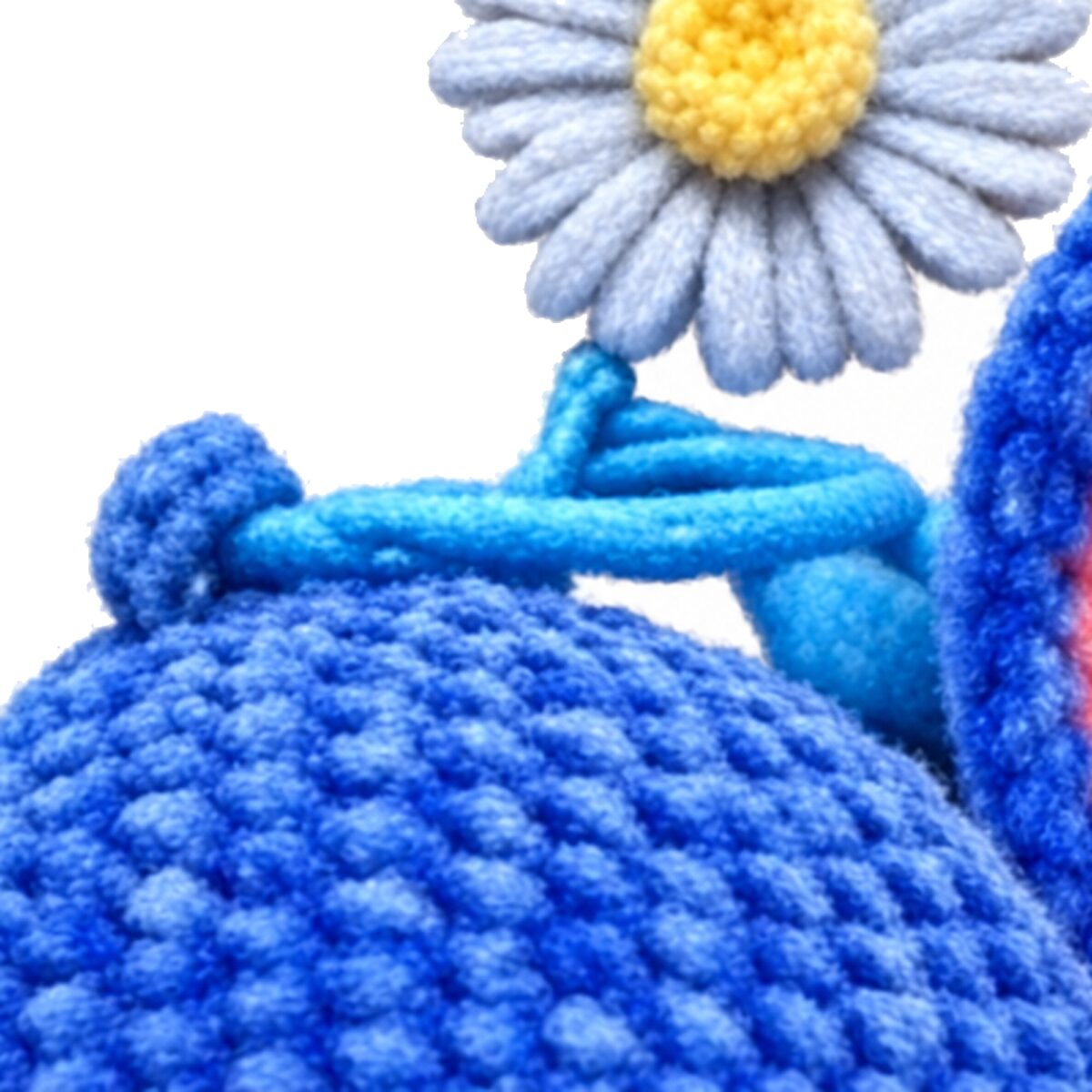 keyring chain and crochet head texture close-up from the crochet blue alien pattern amigurumi