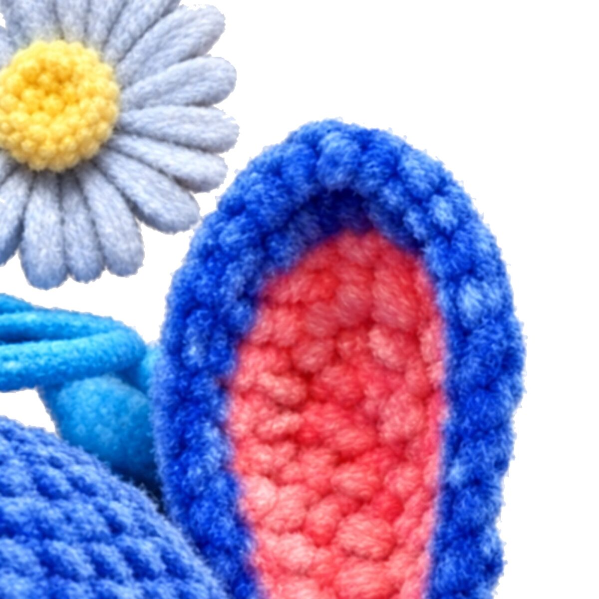 ear inner texture and daisy keyring charm close-up from the crochet blue alien pattern