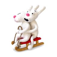 The crochet bunnies on sled pattern seen from a third angle, seated on the wooden runners