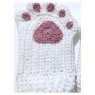 A single glove from the crochet cat paw gloves pattern, paw side up