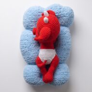 The crochet devil pattern seen from above, with the nappy, arms, legs and tail spread out