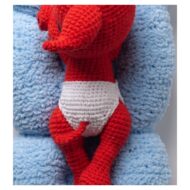 Detail of the little white nappy, the legs and the curled tail from the crochet devil pattern