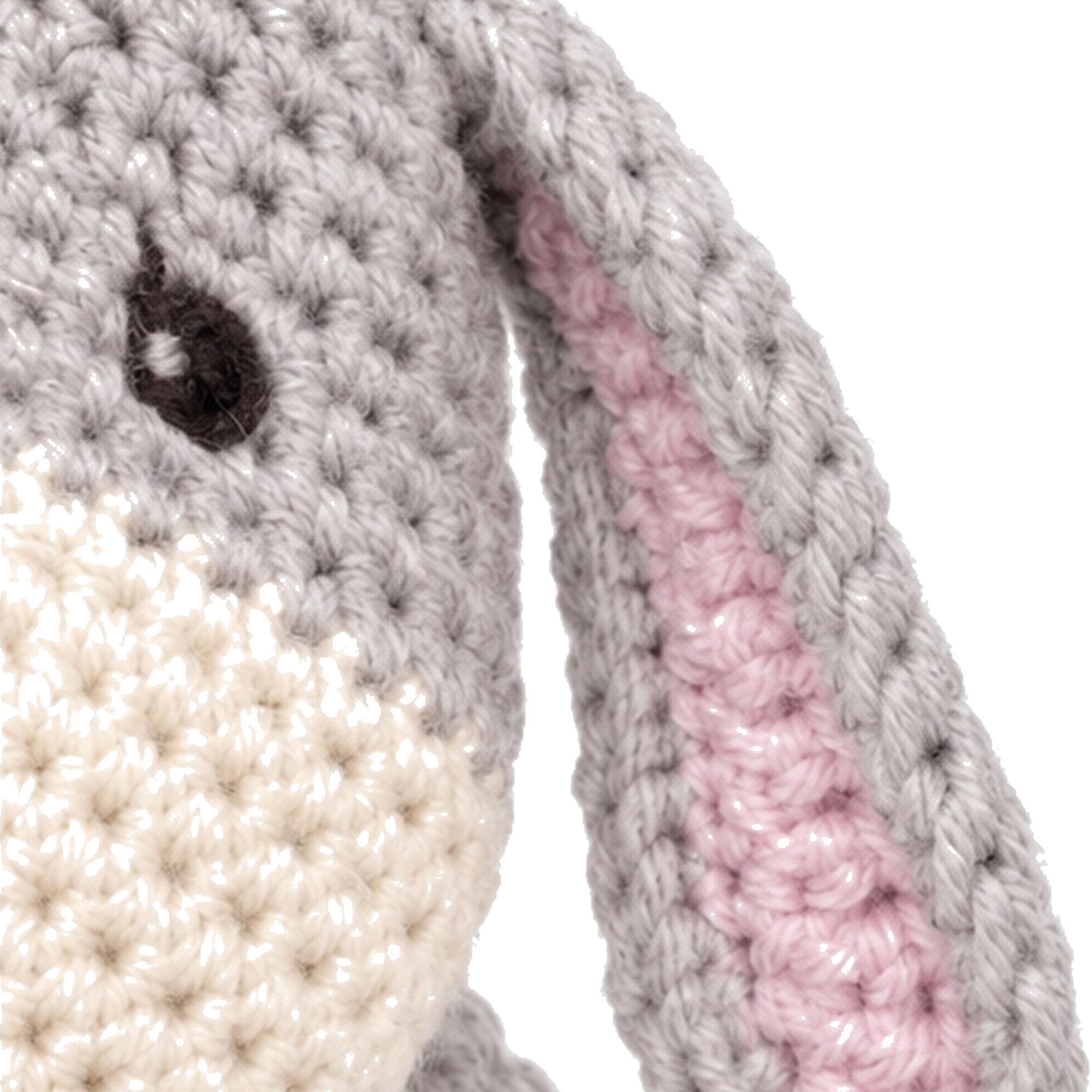 The crochet donkey pattern's ear, grey outer and pink inner lining, on the finished head