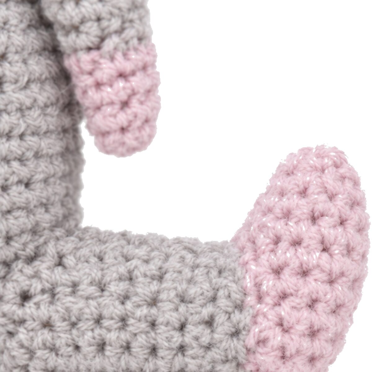 A pink crocheted foot on the crochet donkey pattern's leg