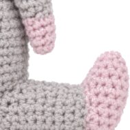A pink crocheted foot on the crochet donkey pattern's leg