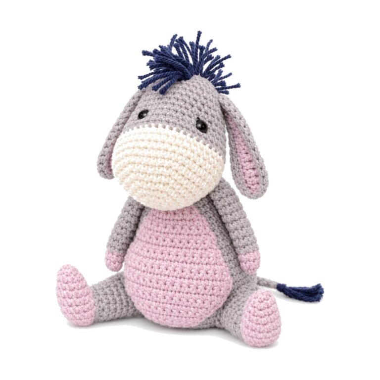 The finished crochet donkey pattern, grey amigurumi donkey with a cream muzzle, pink belly and navy mane