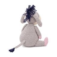 The back view of the crochet donkey pattern, showing the navy fringe mane and tail