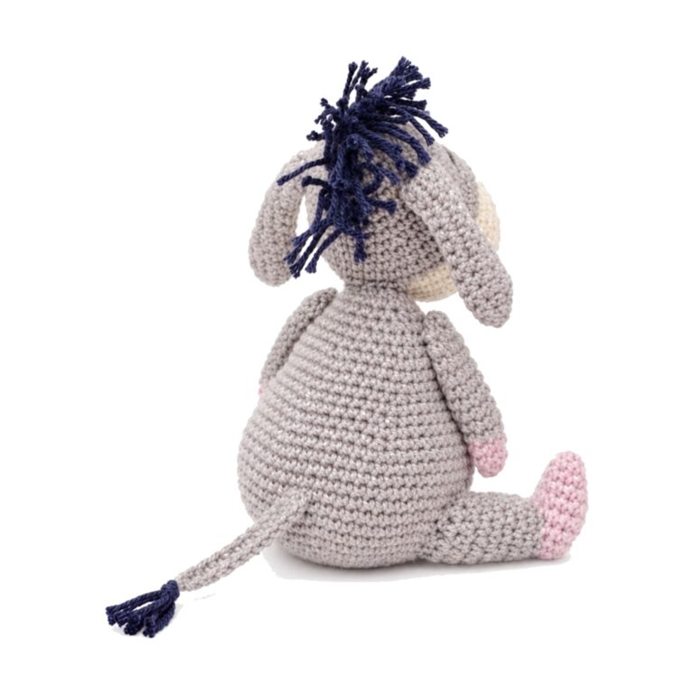 The back view of the crochet donkey pattern, showing the navy fringe mane and tail