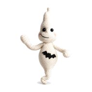 Crochet ghost pattern amigurumi with a smiling face and bat belly, front view