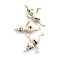 Three crochet ghost pattern amigurumi toys in smiling, frowning and stitched-scar moods