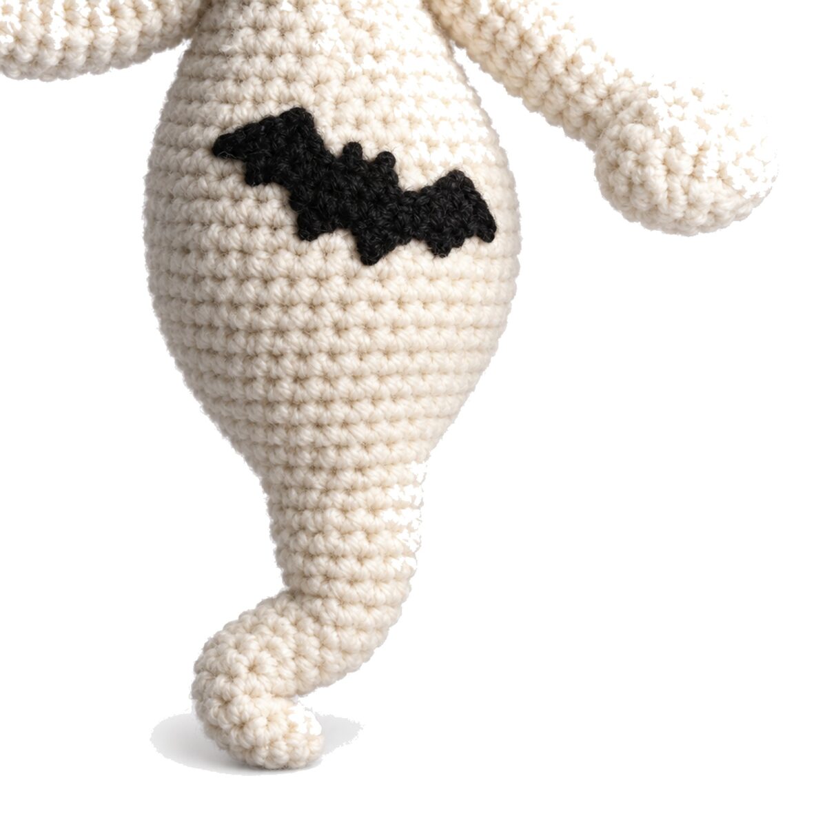 Close-up of the crochet ghost pattern amigurumi's bat belly motif