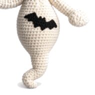 Close-up of the crochet ghost pattern amigurumi's bat belly motif