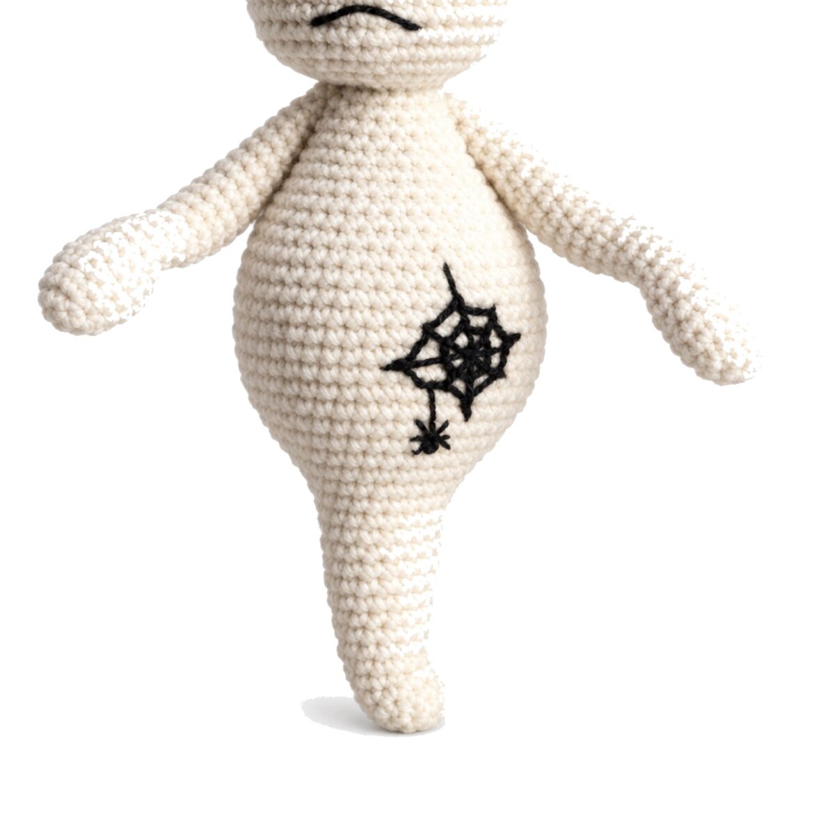 Close-up of the crochet ghost pattern amigurumi's spiderweb belly motif
