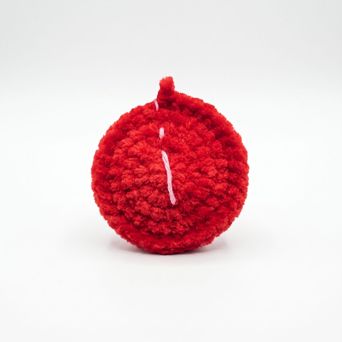 The red crocheted apple that comes with the crochet hedgehog pattern