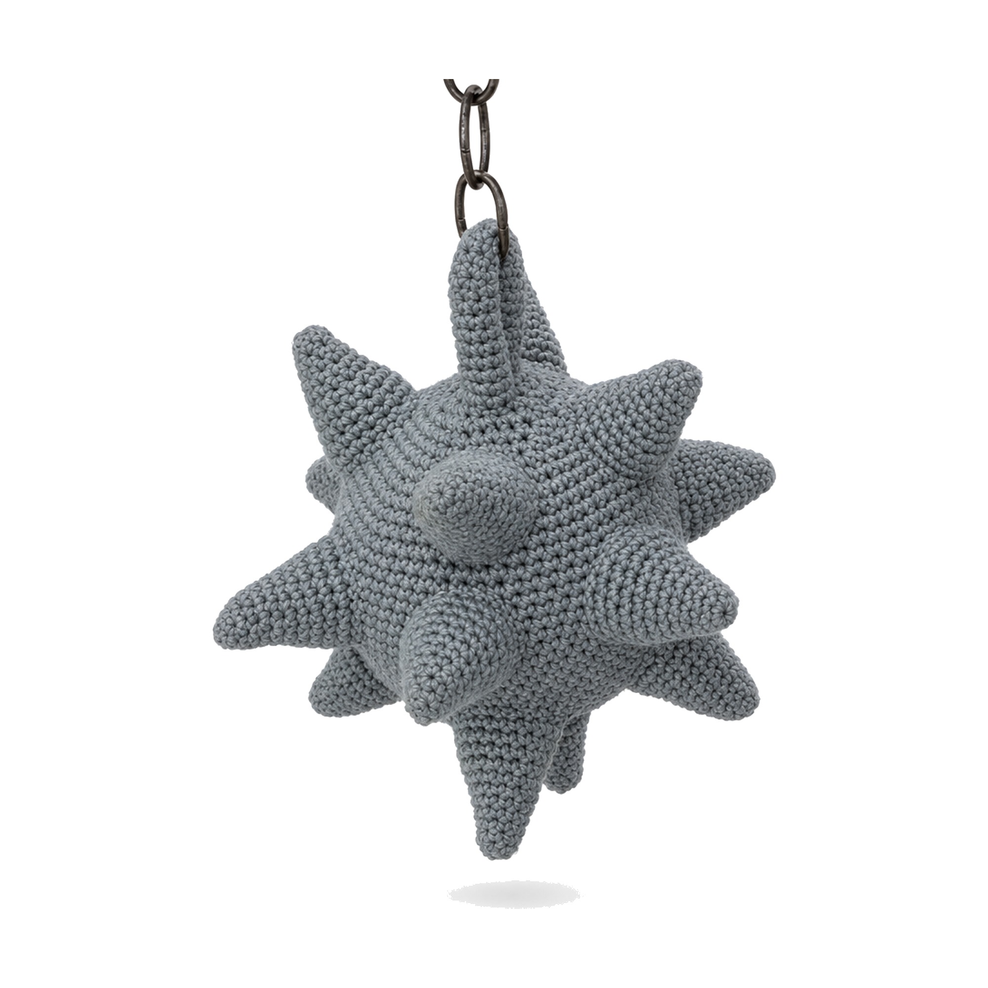 Crochet mace toy pattern spiked ball shown hanging by its chain and hook
