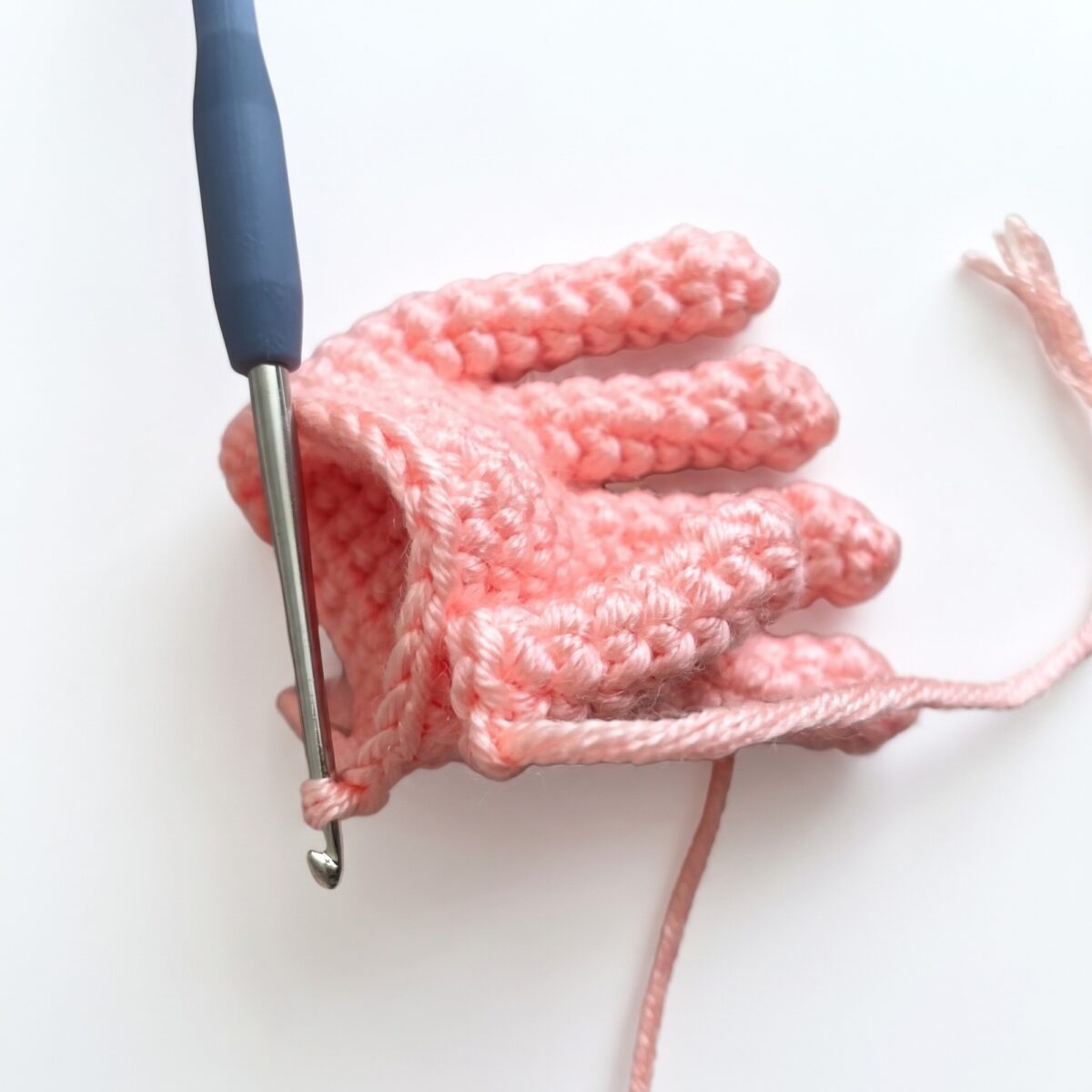 Joining the five separate fingers into one hand, from the crochet monkey pattern